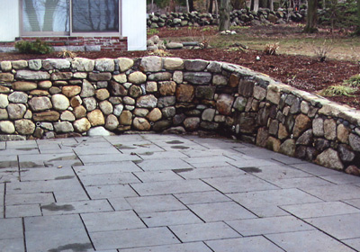 Bluestone patio adjacent to family room with 'dry wall' construction 